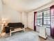 Bright living room featuring a large window and comfortable seating area at 8236 Washington St # 29, Denver, CO 80229