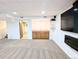Basement wet bar area with oak cabinets, sink, and display shelving at 420 E 104Th Pl, Northglenn, CO 80233