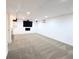 Finished basement with plush carpet, entertainment center, and recessed lighting at 420 E 104Th Pl, Northglenn, CO 80233