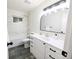 Updated bathroom with marble tiled shower over tub, modern vanity, and sleek fixtures at 420 E 104Th Pl, Northglenn, CO 80233