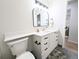 Bathroom featuring modern vanity with elegant sink, fixtures, and marble style floors at 420 E 104Th Pl, Northglenn, CO 80233