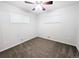 Cozy bedroom featuring plush carpet, a ceiling fan, and natural light from two windows at 420 E 104Th Pl, Northglenn, CO 80233