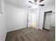 Bedroom features ceiling fan, carpet, closet and access to additional storage at 420 E 104Th Pl, Northglenn, CO 80233