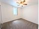 Bedroom features soft carpet, ceiling fan, and a large closet at 420 E 104Th Pl, Northglenn, CO 80233