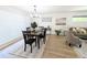 Bright dining room with hardwood floors, seamlessly connects to the living area at 420 E 104Th Pl, Northglenn, CO 80233