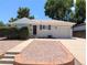 Charming single-story home featuring a well-maintained yard and attached garage on a sunny day at 420 E 104Th Pl, Northglenn, CO 80233
