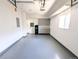 Garage with storage shelves and white painted floor at 420 E 104Th Pl, Northglenn, CO 80233
