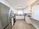 Modern kitchen with white cabinets, stainless steel appliances, and granite countertops at 420 E 104Th Pl, Northglenn, CO 80233