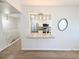 Modern kitchen with stainless steel appliances visible from an open space with hardwood floors at 420 E 104Th Pl, Northglenn, CO 80233
