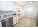 Bright kitchen showcasing stainless steel dishwasher, granite countertops and opening to adjacent room at 420 E 104Th Pl, Northglenn, CO 80233