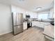 Bright kitchen featuring white cabinets, stainless steel appliances, and granite countertops at 420 E 104Th Pl, Northglenn, CO 80233