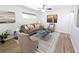 Comfortable living room featuring a ceiling fan, hardwood floors, and neutral decor at 420 E 104Th Pl, Northglenn, CO 80233