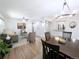 Bright and airy living room with hardwood floors, open to the dining area at 420 E 104Th Pl, Northglenn, CO 80233