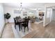 Bright open-concept living and dining area with hardwood floors and stylish decor at 420 E 104Th Pl, Northglenn, CO 80233