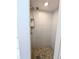 This shower features neutral-toned tile and a modern shower head at 420 E 104Th Pl, Northglenn, CO 80233