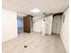 Bright utility room with tile flooring and visible utilities at 420 E 104Th Pl, Northglenn, CO 80233