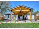 Inviting covered patio with wood beam construction perfect for outdoor entertaining and relaxation at 3200 Ames St, Wheat Ridge, CO 80212