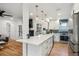 Bright modern kitchen with stainless steel appliances and an open concept at 3200 Ames St, Wheat Ridge, CO 80212
