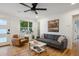 Bright living room with hardwood floors, stylish furnishings, and natural light at 3200 Ames St, Wheat Ridge, CO 80212