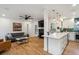 Cozy open-concept with fireplace, open kitchen, and comfortable living area at 3200 Ames St, Wheat Ridge, CO 80212