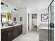 Luxurious bathroom with a double vanity, soaking tub, and a separate shower, offering a spa-like experience at 24005 E Utah Pl, Aurora, CO 80018
