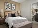 Inviting bedroom with stylish decor, a comfortable bed, and an ensuite bathroom, perfect for relaxation at 24005 E Utah Pl, Aurora, CO 80018