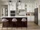 Modern kitchen with stainless steel appliances, a dark wood island, and ample cabinet space at 24005 E Utah Pl, Aurora, CO 80018