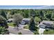 An aerial view of the home surrounded by trees and other homes in the neighborhood at 8696 E Easter Ave, Centennial, CO 80112