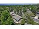 Aerial view of a charming home surrounded by lush greenery and mature trees at 8696 E Easter Ave, Centennial, CO 80112