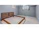 Unfurnished basement room with neutral carpet, light gray walls, and window at 8696 E Easter Ave, Centennial, CO 80112