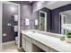 Bathroom with large mirror, neutral countertops, and decorative accents at 8696 E Easter Ave, Centennial, CO 80112
