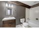 Renovated bathroom with modern vanity, shower, and stylish fixtures at 8696 E Easter Ave, Centennial, CO 80112