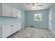 Bright bedroom featuring ample storage with built-in cabinets, neutral carpet and lovely natural light from the window at 8696 E Easter Ave, Centennial, CO 80112