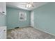 Bright bedroom features neutral carpet, paint, ceiling fan, and window at 8696 E Easter Ave, Centennial, CO 80112