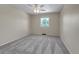 Carpeted bedroom with neutral tones, bright window, and ceiling fan at 8696 E Easter Ave, Centennial, CO 80112