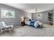 Serene bedroom with a cozy rug, neutral walls, a ceiling fan, and two windows at 8696 E Easter Ave, Centennial, CO 80112