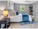 Well-lit bedroom with backyard views, neutral walls, ceiling fan and a comfortable queen-sized bed at 8696 E Easter Ave, Centennial, CO 80112