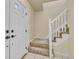 The front door and staircase are visible in this home's entryway at 8696 E Easter Ave, Centennial, CO 80112