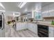 Open concept kitchen flows into the living area, ideal for entertaining and casual dining at 8696 E Easter Ave, Centennial, CO 80112