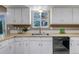 Well-lit kitchen with a window above the sink offers a pleasant cooking experience at 8696 E Easter Ave, Centennial, CO 80112
