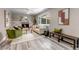 Cozy living room boasts a fireplace, hardwood floors, and natural light creating a warm ambiance at 8696 E Easter Ave, Centennial, CO 80112