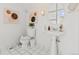 Bright bathroom with modern fixtures, a pedestal sink, and stylish wall art at 1741 N Emerson St, Denver, CO 80218