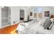 Comfortable bedroom with wood floors, large windows, and decor at 1741 N Emerson St, Denver, CO 80218