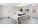 Bright bedroom with skylights, clean lines, white walls, and stylish decor at 1741 N Emerson St, Denver, CO 80218