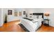 Bright bedroom with hardwood floors, and comfortable furniture at 1741 N Emerson St, Denver, CO 80218
