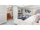 Well-lit bedroom with skylights, en-suite bathroom, and stylish accents create a comfortable retreat at 1741 N Emerson St, Denver, CO 80218