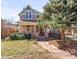 Charming two-story home with front porch and mature landscaping at 1741 N Emerson St, Denver, CO 80218