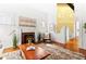 Bright living room with a cozy fireplace, hardwood floors, and stylish decor at 1741 N Emerson St, Denver, CO 80218