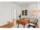 Bright home office with hardwood floors, built-in shelving and a large window for natural light at 1741 N Emerson St, Denver, CO 80218