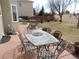 Outdoor patio with dining set, perfect for enjoying meals and relaxing in a backyard setting at 21024 E 49Th Ave, Denver, CO 80249